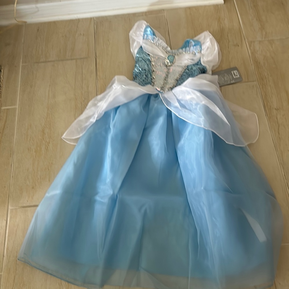 Disney’s brand new Cinderalla dress in blue and white tags on